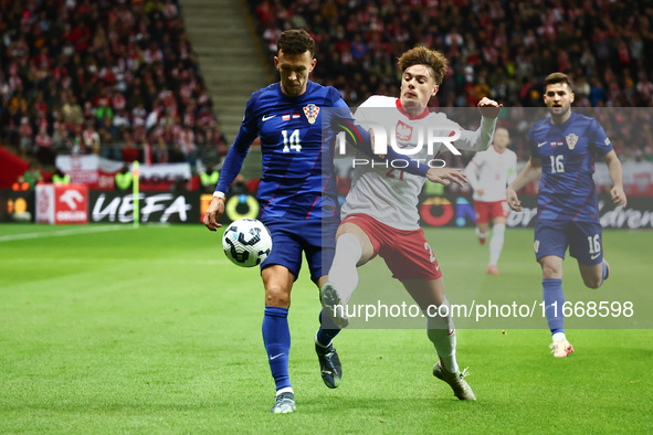 Ivan Perisic of Croatia and Nicola Zalewski of Poland during UEFA Nations League football match Poland - Croatia at National Stadium in Wars...