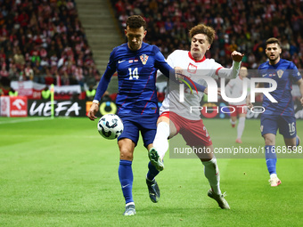 Ivan Perisic of Croatia and Nicola Zalewski of Poland during UEFA Nations League football match Poland - Croatia at National Stadium in Wars...