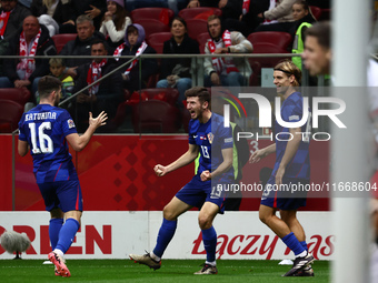 Martin Baturina and Petar Sucic of Croatia celebrate the goal during UEFA Nations League football match Poland - Croatia at National Stadium...