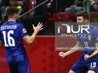 Martin Baturina and Petar Sucic of Croatia celebrate the goal during UEFA Nations League football match Poland - Croatia at National Stadium...