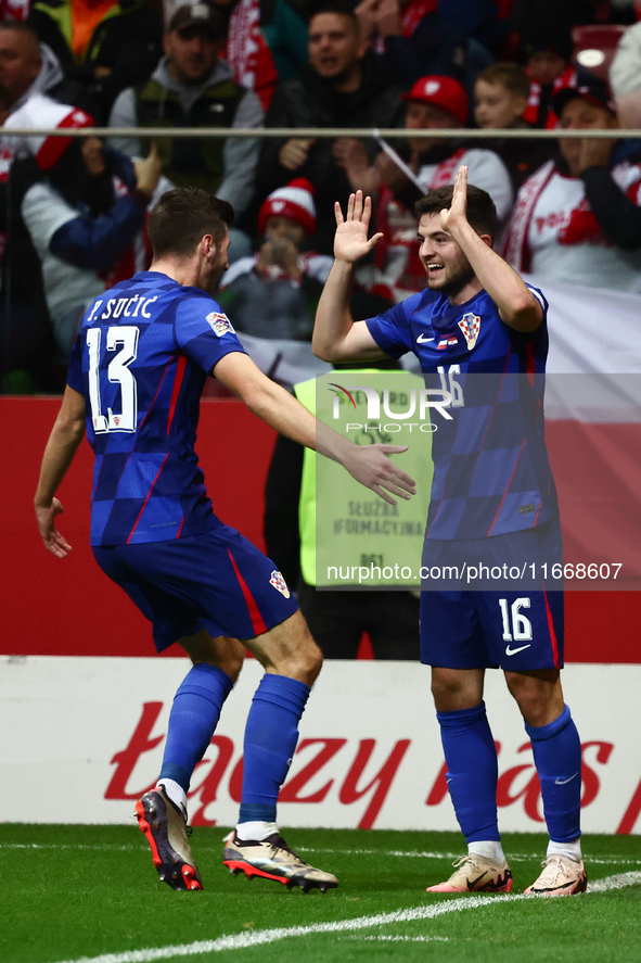 Petar Sucic and Martin Baturina of Croatia celebrate the goal during UEFA Nations League football match Poland - Croatia at National Stadium...