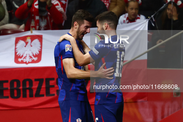 Petar Sucic and Martin Baturina of Croatia celebrate the goal during UEFA Nations League football match Poland - Croatia at National Stadium...