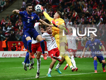 Josip Sutalo of Croatia and Marcin Bulka of Poland during UEFA Nations League football match Poland - Croatia at National Stadium in Warsaw,...