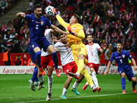 Josip Sutalo of Croatia and Marcin Bulka of Poland during UEFA Nations League football match Poland - Croatia at National Stadium in Warsaw,...