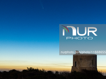 The comet Tsuchinshan-ATLAS (C/2023 A3) is seen over Torre del Pizzo, in Gallipoli, Italy, on October 15, 2024. The comet's coma, or head, m...