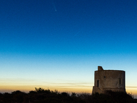 The comet Tsuchinshan-ATLAS (C/2023 A3) is seen over Torre del Pizzo, in Gallipoli, Italy, on October 15, 2024. The comet's coma, or head, m...