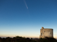 The comet Tsuchinshan-ATLAS (C/2023 A3) is seen over Torre del Pizzo, in Gallipoli, Italy, on October 15, 2024. The comet's coma, or head, m...