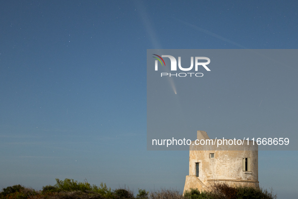 The comet Tsuchinshan-ATLAS (C/2023 A3) with a comet’s coma and anti-tail is seen over Torre del Pizzo, in Gallipoli, Italy, on October 15,...