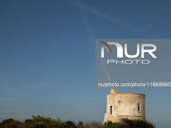 The comet Tsuchinshan-ATLAS (C/2023 A3) is seen over Torre del Pizzo, in Gallipoli, Italy, on October 15, 2024. The comet's coma, or head, m...