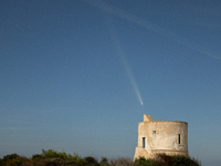 The comet Tsuchinshan-ATLAS (C/2023 A3) is seen over Torre del Pizzo, in Gallipoli, Italy, on October 15, 2024. The comet's coma, or head, m...