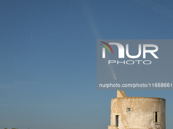 The comet Tsuchinshan-ATLAS (C/2023 A3) is seen over Torre del Pizzo, in Gallipoli, Italy, on October 15, 2024. The comet's coma, or head, m...