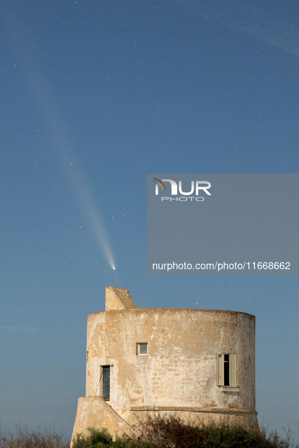 The comet Tsuchinshan-ATLAS (C/2023 A3) is seen over Torre del Pizzo, in Gallipoli, Italy, on October 15, 2024. The comet's coma, or head, m...