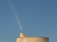 The comet Tsuchinshan-ATLAS (C/2023 A3) is seen over Torre del Pizzo, in Gallipoli, Italy, on October 15, 2024. The comet's coma, or head, m...