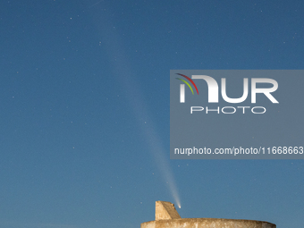 The comet Tsuchinshan-ATLAS (C/2023 A3) is seen over Torre del Pizzo, in Gallipoli, Italy, on October 15, 2024. The comet's coma, or head, m...