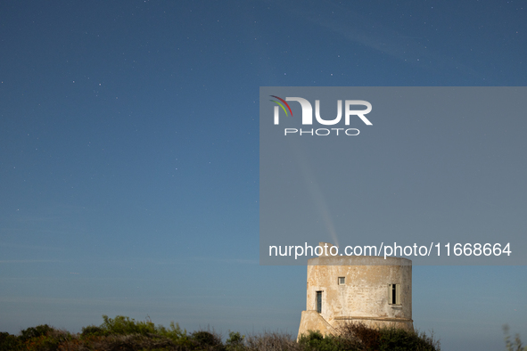 The comet Tsuchinshan-ATLAS (C/2023 A3) is seen over Torre del Pizzo, in Gallipoli, Italy, on October 15, 2024. The comet's coma, or head, m...