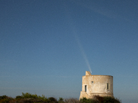 The comet Tsuchinshan-ATLAS (C/2023 A3) is seen over Torre del Pizzo, in Gallipoli, Italy, on October 15, 2024. The comet's coma, or head, m...