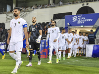 Palestine and Kuwait players walk onto the pitch before the FIFA World Cup 2026 Qualification 3rd Round group B match between Palestine and...