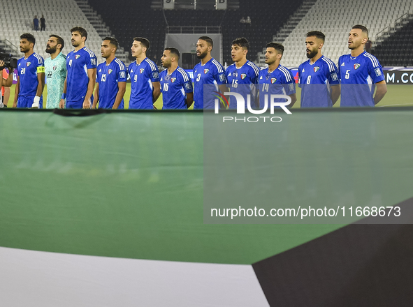 Kuwait players stand for their national anthem before the FIFA World Cup 2026 Qualification 3rd Round group B match between Palestine and Ku...