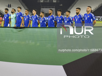 Kuwait players stand for their national anthem before the FIFA World Cup 2026 Qualification 3rd Round group B match between Palestine and Ku...