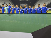 Kuwait players stand for their national anthem before the FIFA World Cup 2026 Qualification 3rd Round group B match between Palestine and Ku...