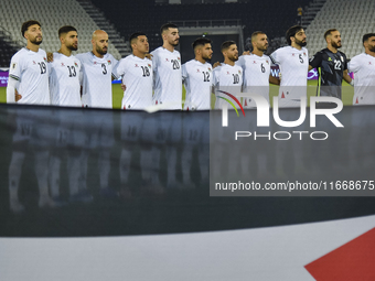 Palestine players stand for their national anthem before the FIFA World Cup 2026 Qualification 3rd Round group B match between Palestine and...