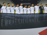 Palestine players stand for their national anthem before the FIFA World Cup 2026 Qualification 3rd Round group B match between Palestine and...