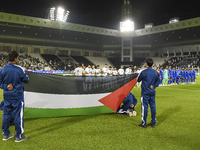 Palestine (left) and Kuwait (right) team players line up before the FIFA World Cup 2026 Qualification 3rd Round group B match between Palest...