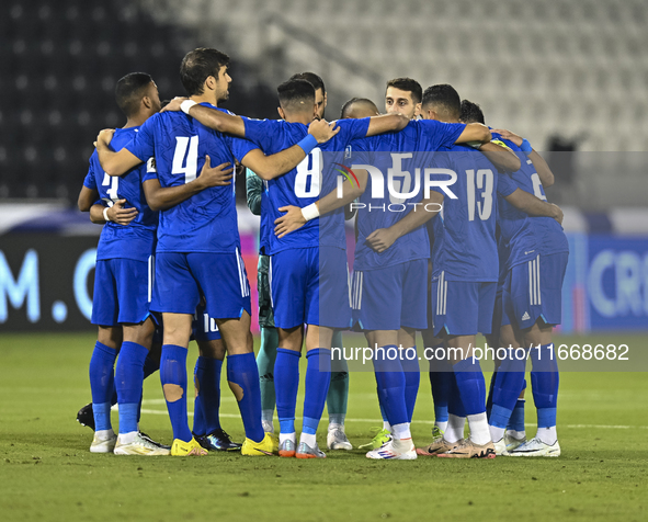 Players of Kuwait stand before the FIFA World Cup 2026 Qualification 3rd Round group B match between Palestine and Kuwait at Jassim Bin Hama...