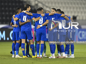 Players of Kuwait stand before the FIFA World Cup 2026 Qualification 3rd Round group B match between Palestine and Kuwait at Jassim Bin Hama...