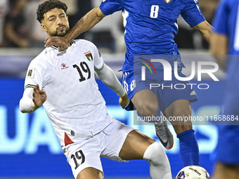 Wessam Abouli of Palestine competes for the ball with Ahmad Aldhefiri of Kuwait during the FIFA World Cup 2026 Qualification 3rd Round group...