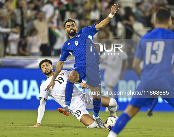 Wessam Abouli of Palestine competes for the ball with Ahmad Aldhefiri of Kuwait during the FIFA World Cup 2026 Qualification 3rd Round group...