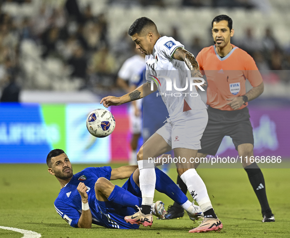 Jonathan Zorrilla of Palestine competes for the ball with Fahad Alhajeri of Kuwait during the FIFA World Cup 2026 Qualification 3rd Round gr...