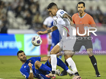 Jonathan Zorrilla of Palestine competes for the ball with Fahad Alhajeri of Kuwait during the FIFA World Cup 2026 Qualification 3rd Round gr...