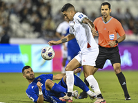 Jonathan Zorrilla of Palestine competes for the ball with Fahad Alhajeri of Kuwait during the FIFA World Cup 2026 Qualification 3rd Round gr...