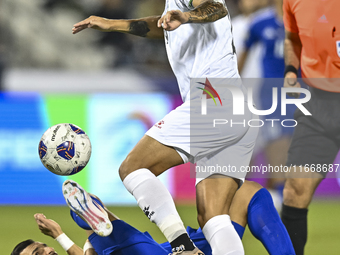 Jonathan Zorrilla of Palestine competes for the ball with Fahad Alhajeri of Kuwait during the FIFA World Cup 2026 Qualification 3rd Round gr...