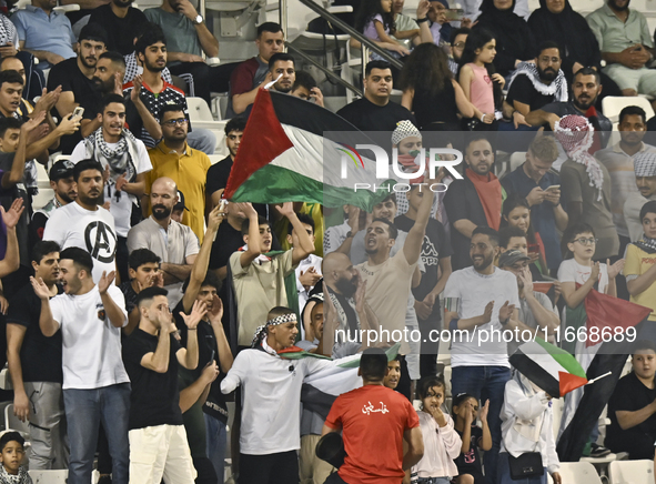 Palestine supporters cheer for their team during the FIFA World Cup 2026 Asian Qualifiers third round group B match between Palestine and Ku...