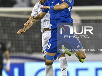 Mohammed Rashid (L) of Palestine battles for the ball with Salman Mohammed of Kuwait during the FIFA World Cup 2026 Qualification 3rd Round...