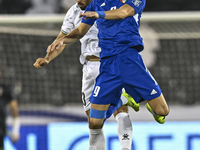 Mohammed Rashid (L) of Palestine battles for the ball with Salman Mohammed of Kuwait during the FIFA World Cup 2026 Qualification 3rd Round...