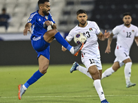 Omar Faraj of Palestine competes for the ball with Rashed Aldousari of Kuwait during the FIFA World Cup 2026 Qualification 3rd Round group B...