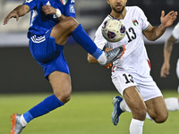 Omar Faraj of Palestine competes for the ball with Rashed Aldousari of Kuwait during the FIFA World Cup 2026 Qualification 3rd Round group B...