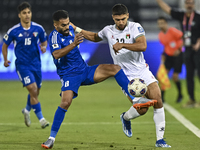 Omar Faraj of Palestine competes for the ball with Rashed Aldousari of Kuwait during the FIFA World Cup 2026 Qualification 3rd Round group B...