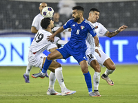 Jonathan Zorrilla of Palestine battles for the ball with Ahmad Aldhefiri of Kuwait during the FIFA World Cup 2026 Qualification 3rd Round gr...