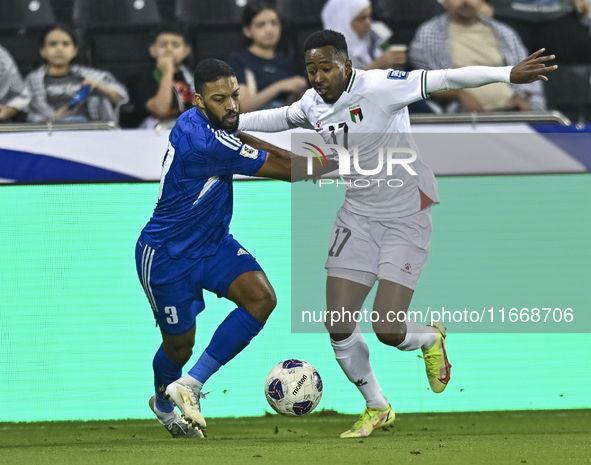 Mousa Farawi of Palestine battles for the ball with Meshari Alenezi of Kuwait during the FIFA World Cup 2026 Qualification 3rd Round group B...