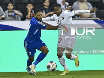 Mousa Farawi of Palestine battles for the ball with Meshari Alenezi of Kuwait during the FIFA World Cup 2026 Qualification 3rd Round group B...