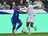 Mousa Farawi of Palestine battles for the ball with Meshari Alenezi of Kuwait during the FIFA World Cup 2026 Qualification 3rd Round group B...