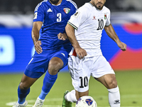 Mahmoud Abuwarda of Palestine battles for the ball with Meshari Alenezi of Kuwait during the FIFA World Cup 2026 Qualification 3rd Round gro...