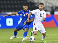 Mahmoud Abuwarda of Palestine battles for the ball with Meshari Alenezi of Kuwait during the FIFA World Cup 2026 Qualification 3rd Round gro...