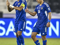 Yousef Alsulaiman (L) of Kuwait celebrates with his teammates after scoring a goal during the FIFA World Cup 2026 Qualification 3rd Round gr...