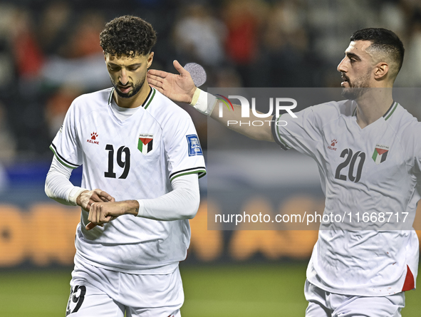 Wessam Abouli (L) of Palestine celebrates after scoring a goal during the FIFA World Cup 2026 Qualification 3rd Round group B match between...