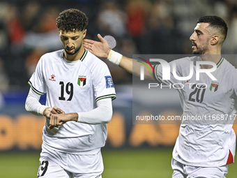 Wessam Abouli (L) of Palestine celebrates after scoring a goal during the FIFA World Cup 2026 Qualification 3rd Round group B match between...